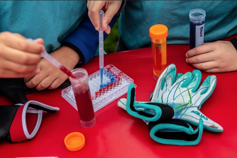 Children making pipette art 