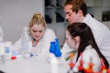 Teacher and two students pipetting