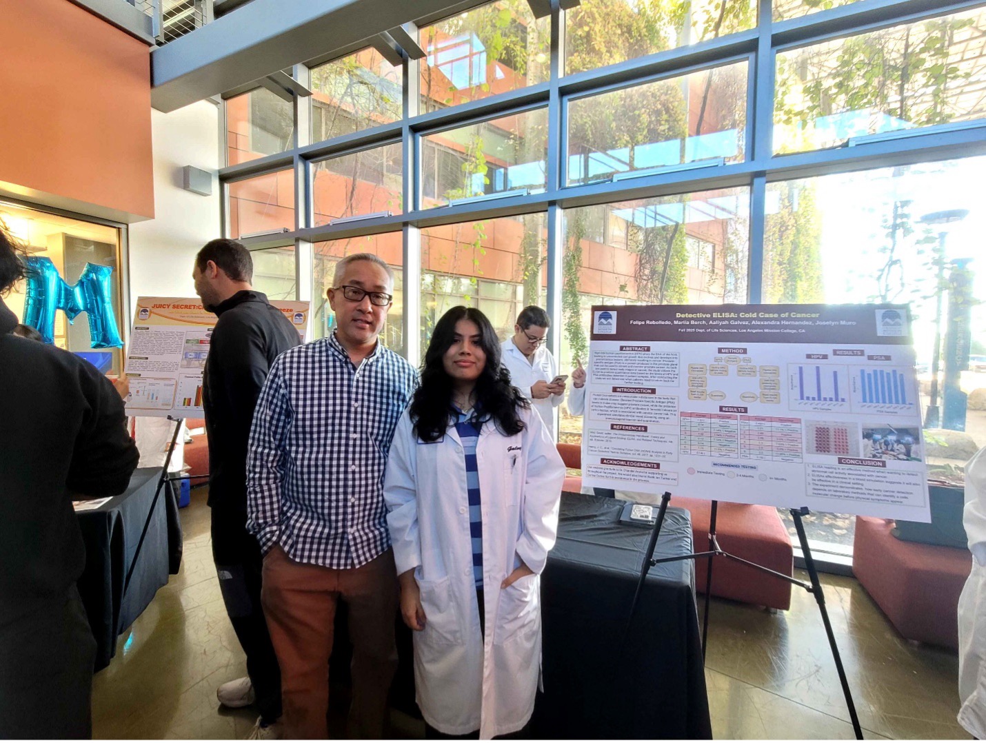 Aaliyah posing with poster